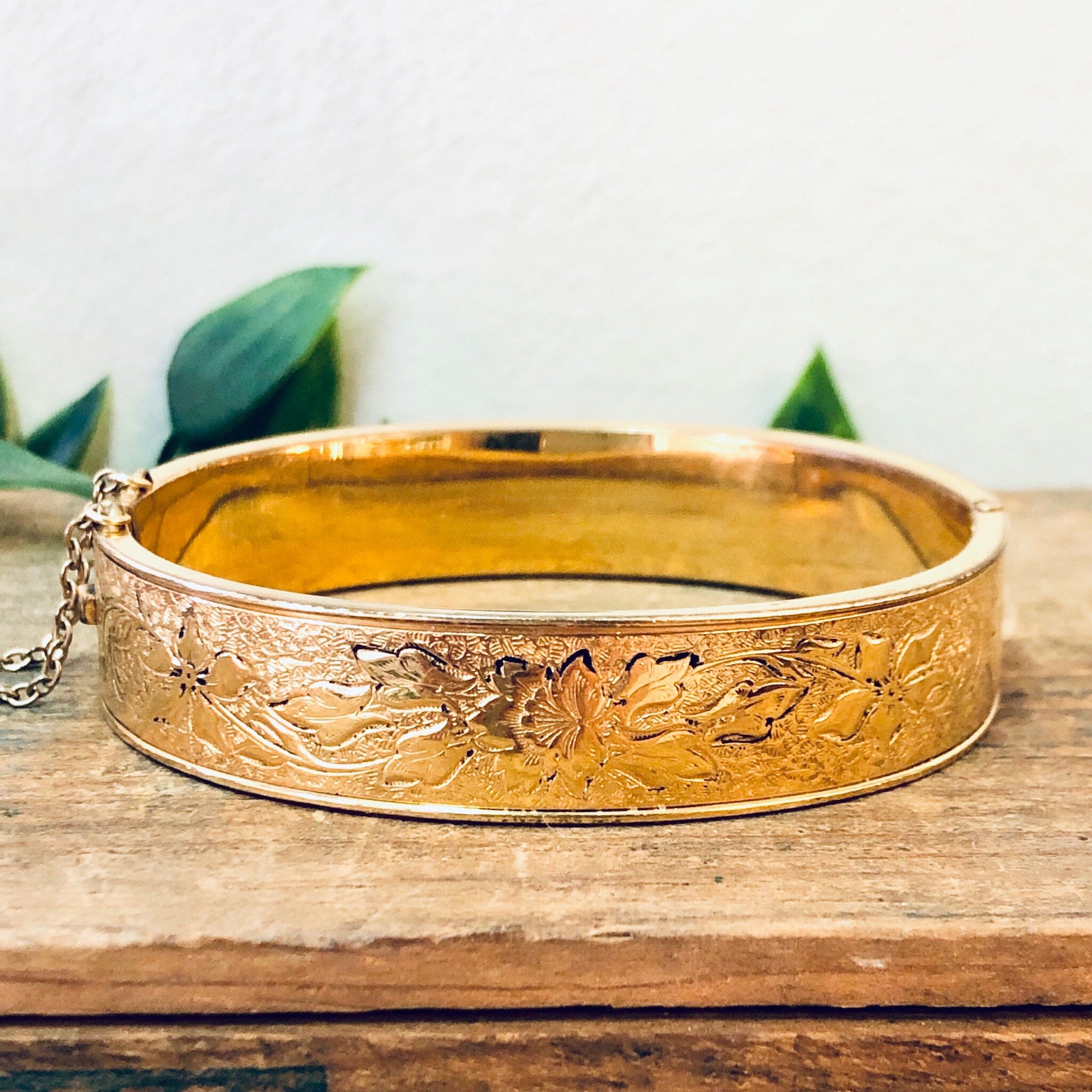 Vintage gold filled bangle bracelet with intricate etched floral design