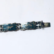 Vintage sterling silver bracelet with blue enamel featuring goddess motifs, a small bracelet marked Siam 925 silver.