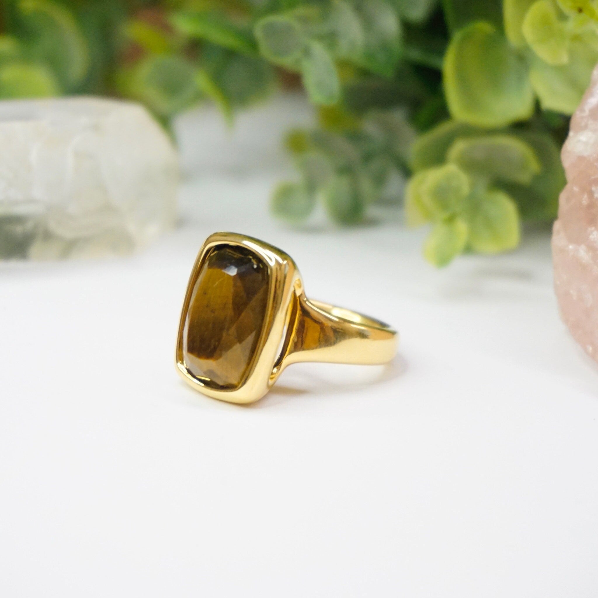 Vintage 14K gold tigers eye ring with a large, rectangular cut tigers eye stone set in a polished gold setting, made by Milor in Italy using 14K gold over resin.