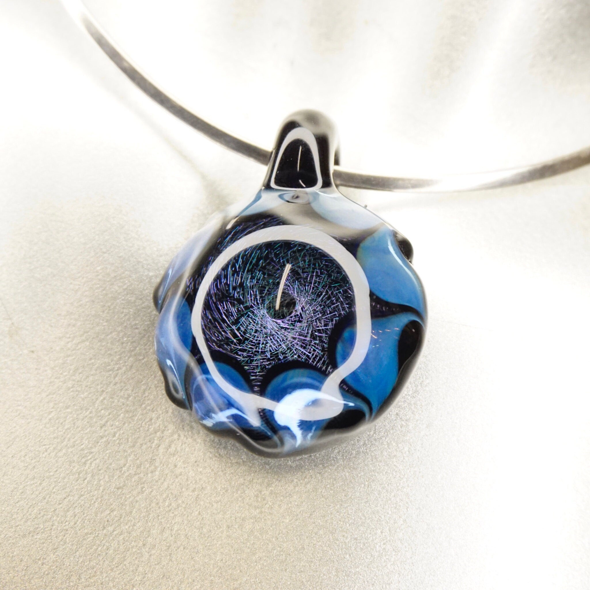Blue and black glass pendant with abstract swirl design, retro modernist artisan jewelry
