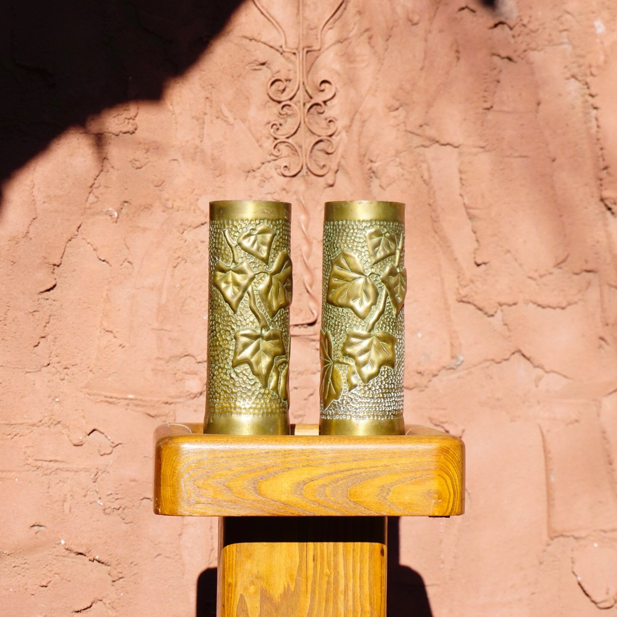 Antique French WWI trench art brush holders made from etched brass shell casings with leaf design, circa 1917.