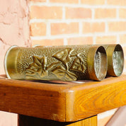 Antique brass shell casing repurposed as brush holder with etched leaf design, World War I trench art from France dated 1917.