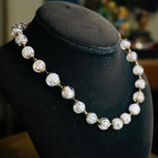 Vintage Italian Murano glass wedding cake bead choker necklace displayed on black jewelry bust