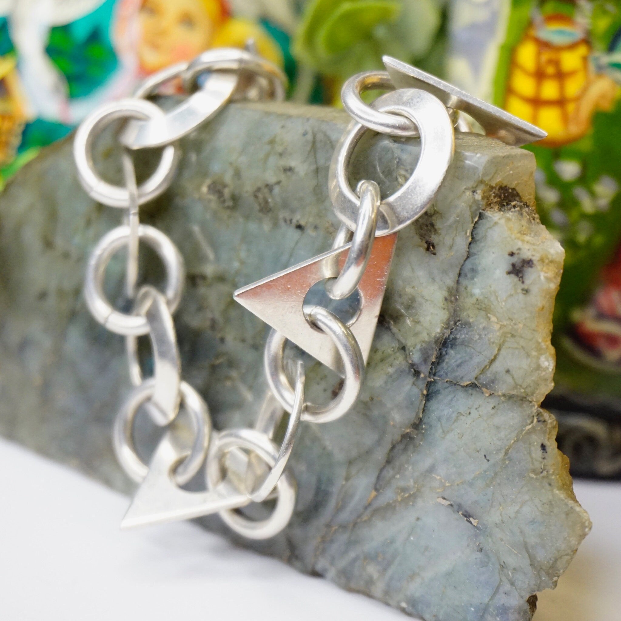 Vintage sterling silver link bracelet with geometric shapes on stone background, Taxco Mexico 925 jewelry