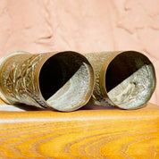 Antique French trench art brush holders made from etched brass shell casings with leaf design, dated 1917.