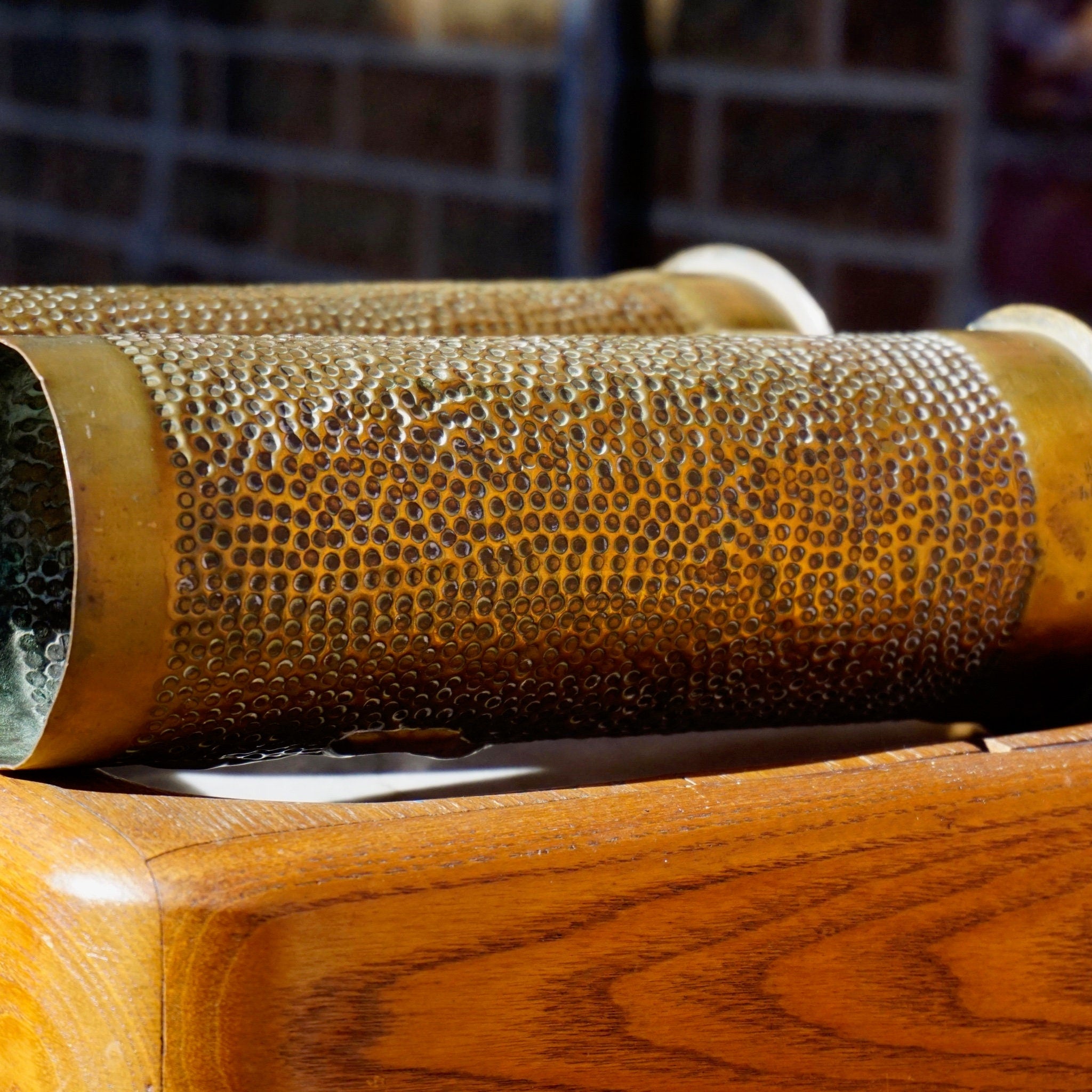 Antique brass shell casing repurposed as an etched brush holder with leaf design, WWI trench art from 1917 France.