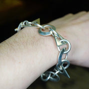 Vintage sterling silver link bracelet with geometric shapes and interlocking links, crafted in Taxco, Mexico. A modern 925 silver jewelry piece with an elegant, timeless design.