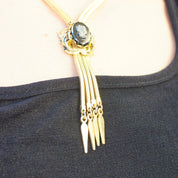 Vintage Gold Tone Cameo Necklace, Unique Bolo Tie Necklace With Gold Tassels, Embossed Hematite Cameo Pendant, 2-Strand Herringbone Chain