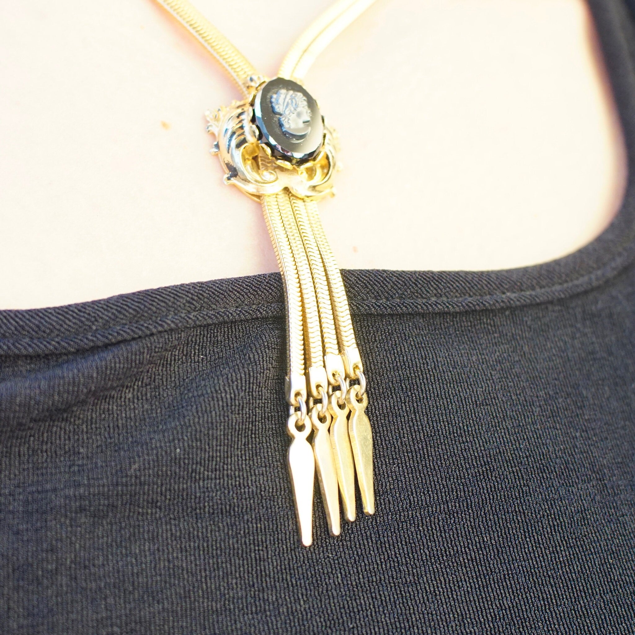 Vintage Gold Tone Cameo Necklace, Unique Bolo Tie Necklace With Gold Tassels, Embossed Hematite Cameo Pendant, 2-Strand Herringbone Chain