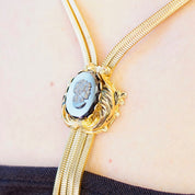 Vintage Gold Tone Cameo Necklace, Unique Bolo Tie Necklace With Gold Tassels, Embossed Hematite Cameo Pendant, 2-Strand Herringbone Chain