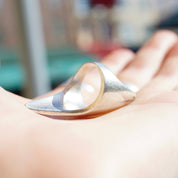 Vintage sterling silver lightning bolt ring resting on an open palm, showing elongated pointed design. Petite long silver ring made in Israel, 925 silver, size 5 1/2 US.