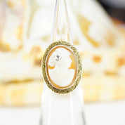 Vintage 14K gold and diamond cameo ring featuring an ornate carved shell cameo set in an antique gold mounting with an accent diamond, ring size 3 3/4 US.