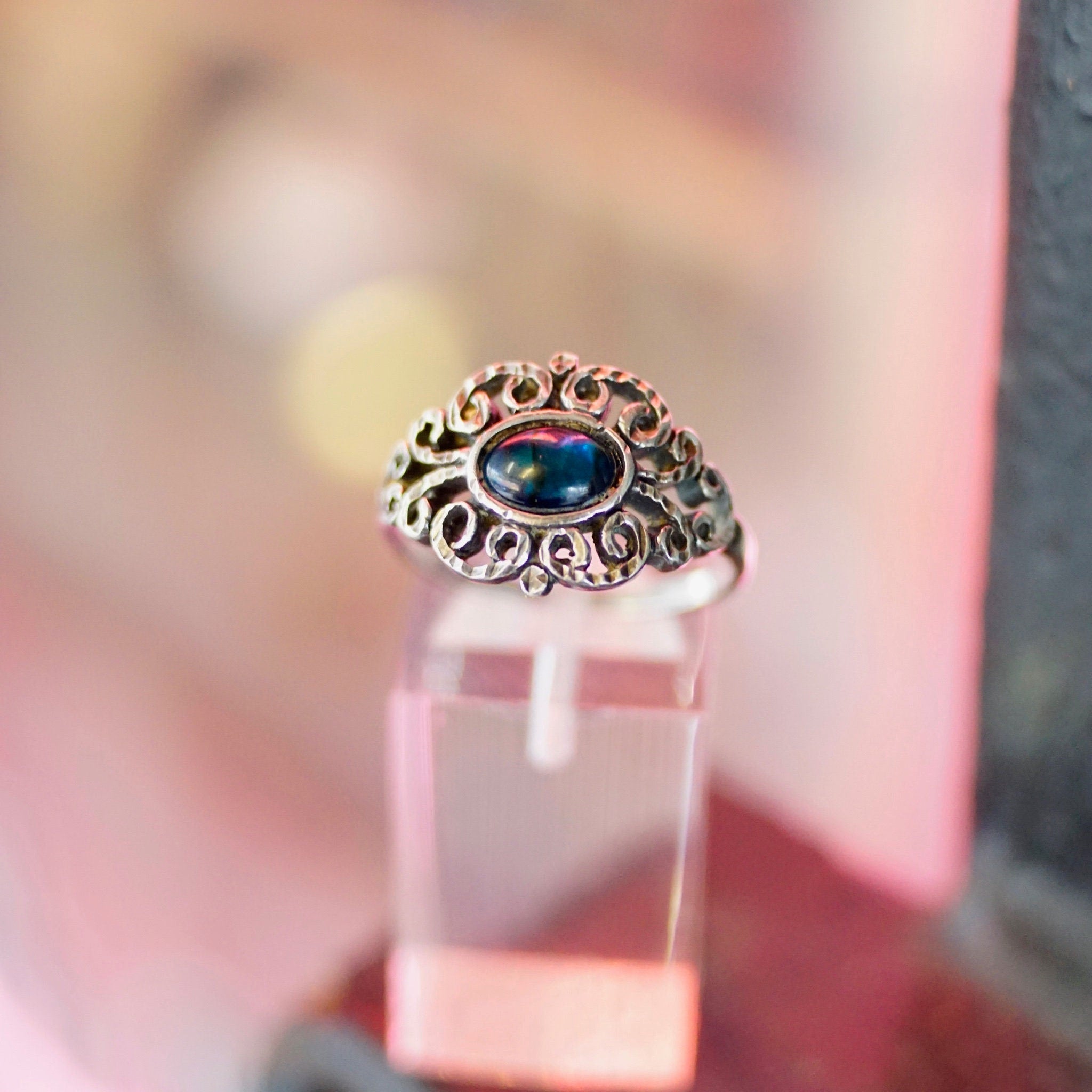 Vintage ornate sterling silver ring with iridescent blue glass stone, featuring a hammered and textured design. Size 9 1/4 US.