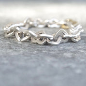 Tiffany & Co 18K gold and sterling silver heart link bracelet, two-tone curb link design, 7 1/2 inches long, vintage jewelry from 2000.