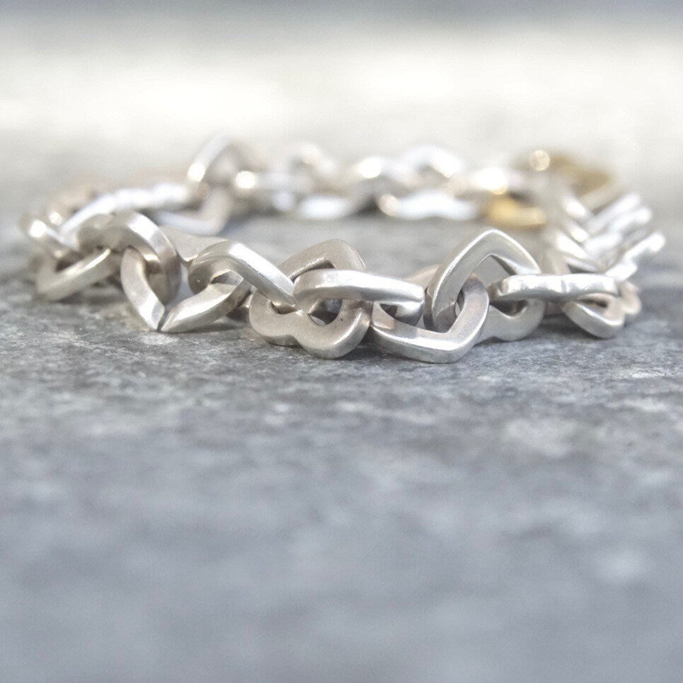 Tiffany & Co 18K gold and sterling silver heart link bracelet, two-tone curb link design, 7 1/2 inches long, vintage jewelry from 2000.