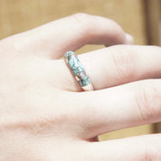 Vintage sterling silver turquoise inlay ring on a hand, featuring a light blue speckled turquoise inlay on a tapered silver band, size 8 1/2 US.