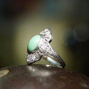 Vintage 18K white gold Art Deco filigree ring with matte green turquoise cabochon and diamond accents, size 7 3/4 US.