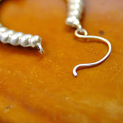 Vintage Sterling Silver Repousse Hoop Earrings, Rippled Hollow U-Shape Dangle Earrings, Ornate Silver Huggie Hoops With Accent Flare, 2" L