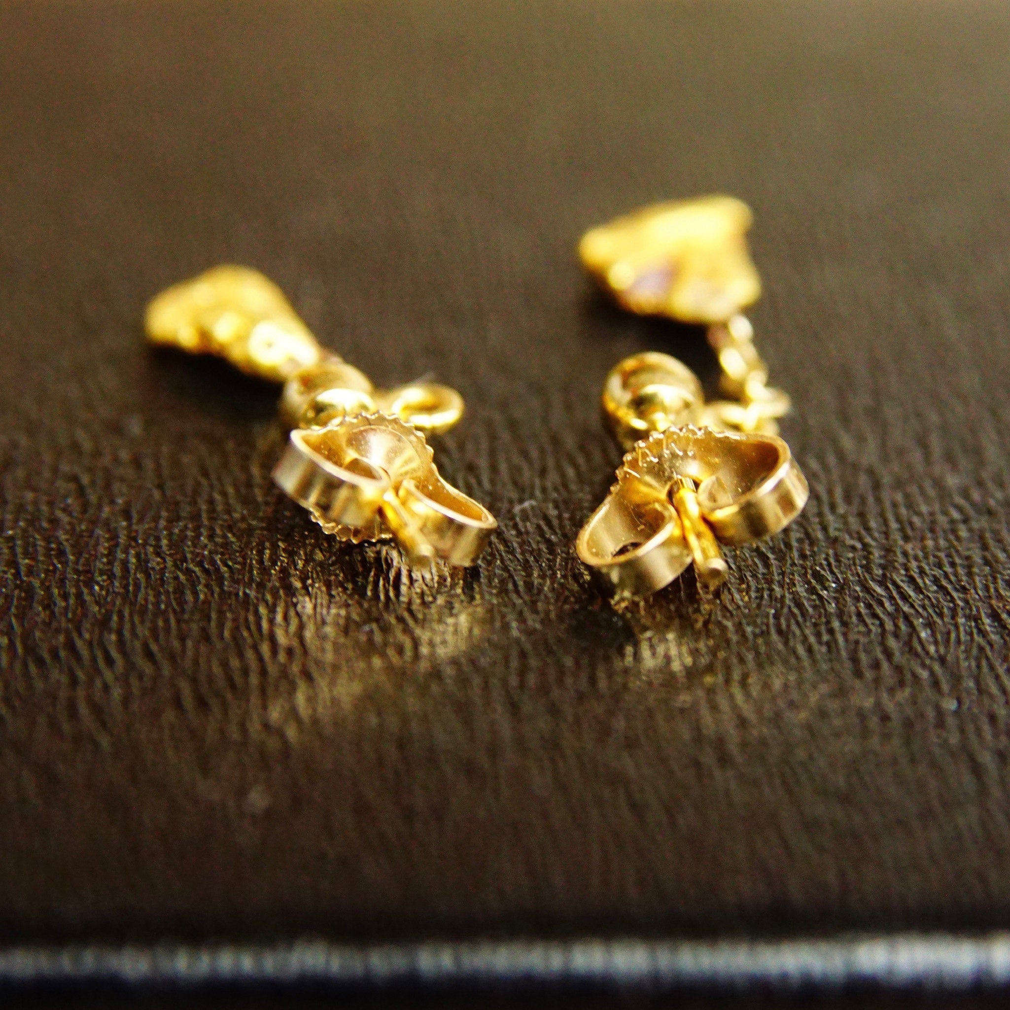 Vintage 14K yellow gold nugget dangle earrings with natural gold nuggets, petite gold post tassel design and 14K gold push backs, measuring 5/8 inches long.