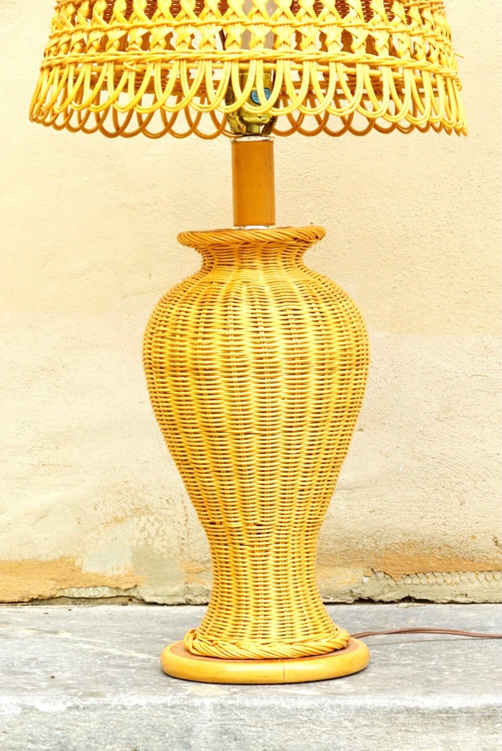 Vintage mid-century modern wicker table lamp with matching woven shade in natural yellow color, featuring an intricate wicker weave design and elegant urn-shaped base, in great condition, measuring 29 inches tall and 16 inches wide, available for local pickup in Philadelphia.