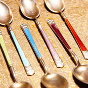 Antique set of 6 colorful Art Deco sterling silver guilloche enamel demitasse spoons with Scandinavian 930S hallmarks, arranged on textured gold background