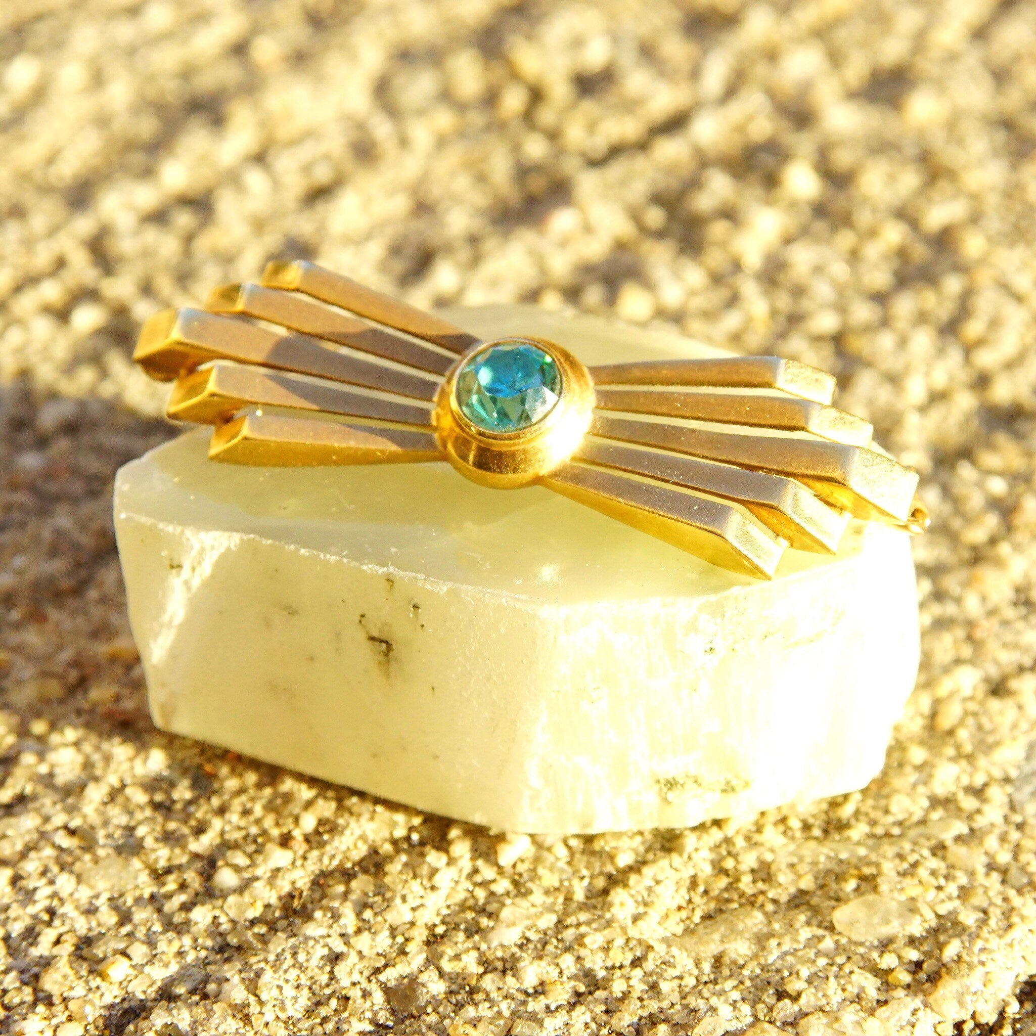 Vintage 14K rose gold Art Deco bar pin brooch with brilliant blue aquamarine gemstone in a golden ray setting, measuring 2 inches long, 585 jewelry hallmark.