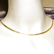 Vintage 14K yellow gold Italian omega collar necklace with minimalist design, 4mm wide, 16 inches long, lustrous finish, stamped 585 for 14K gold purity, made in Italy.