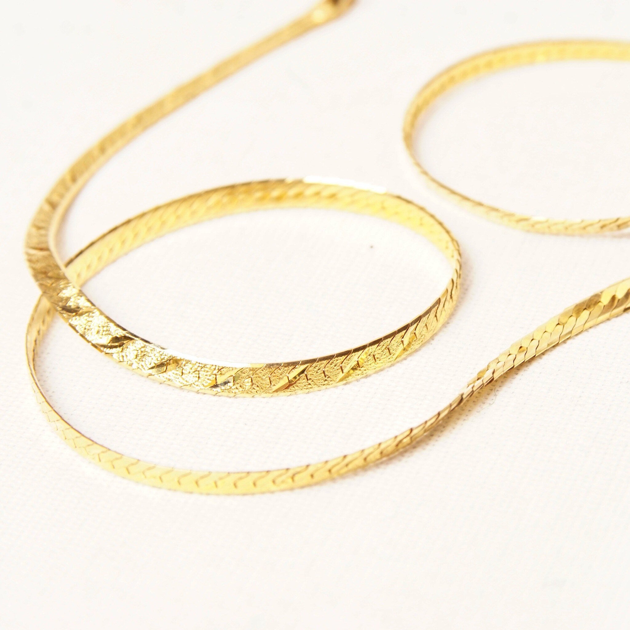 14K yellow gold Italian herringbone chain necklace with diamond-cut texture and reversible design, measuring 3.5mm wide and 20 inches long.