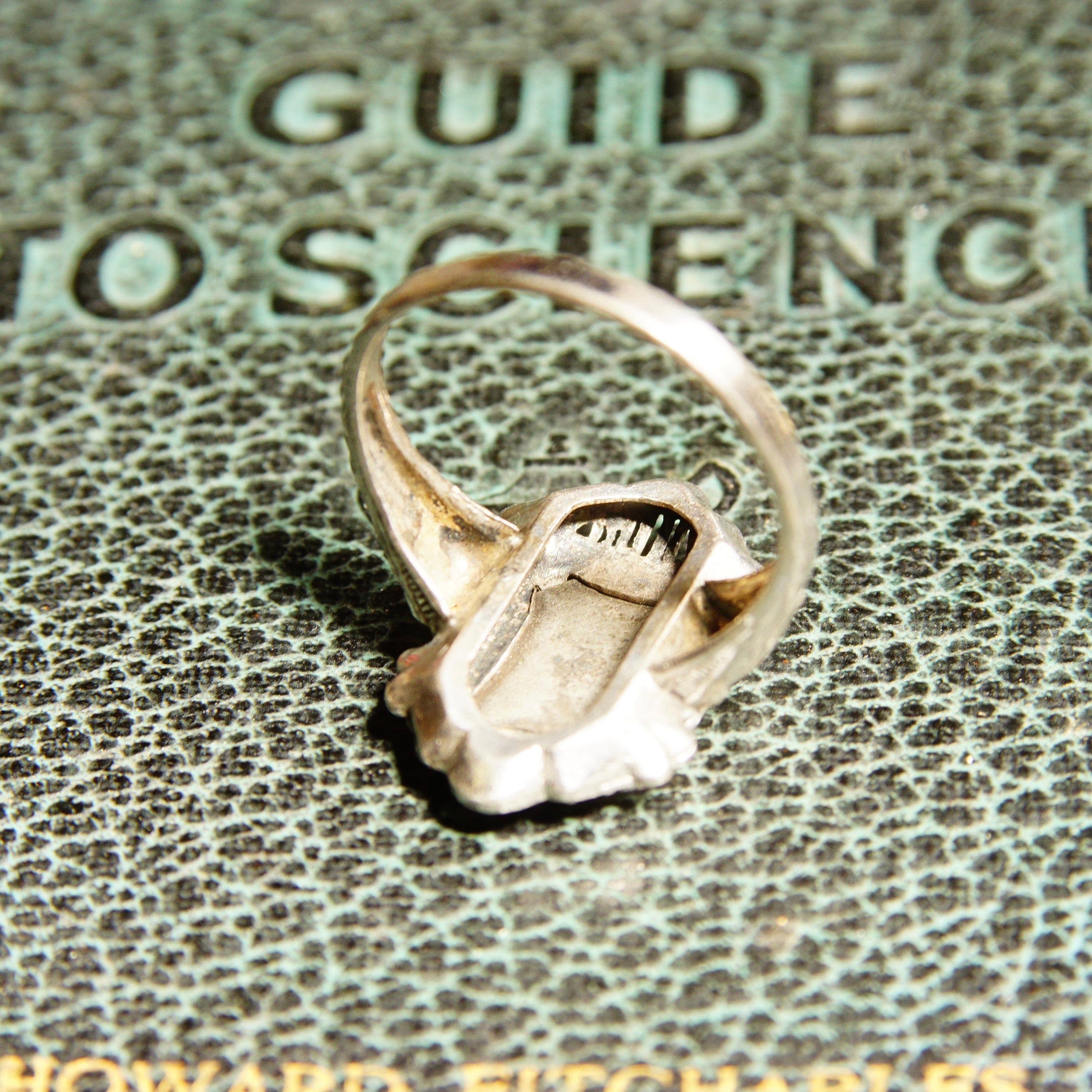 Vintage Sterling Silver Filigree Enamel Order Of The Eastern Star Ring on antique book cover with "GUIDE TO SEEING" text