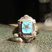Vintage sterling silver filigree Order of the Eastern Star ring with blue and black enamel, featuring an intricate Art Deco design. Masonic his and her 925 silver jewelry from the early 20th century.
