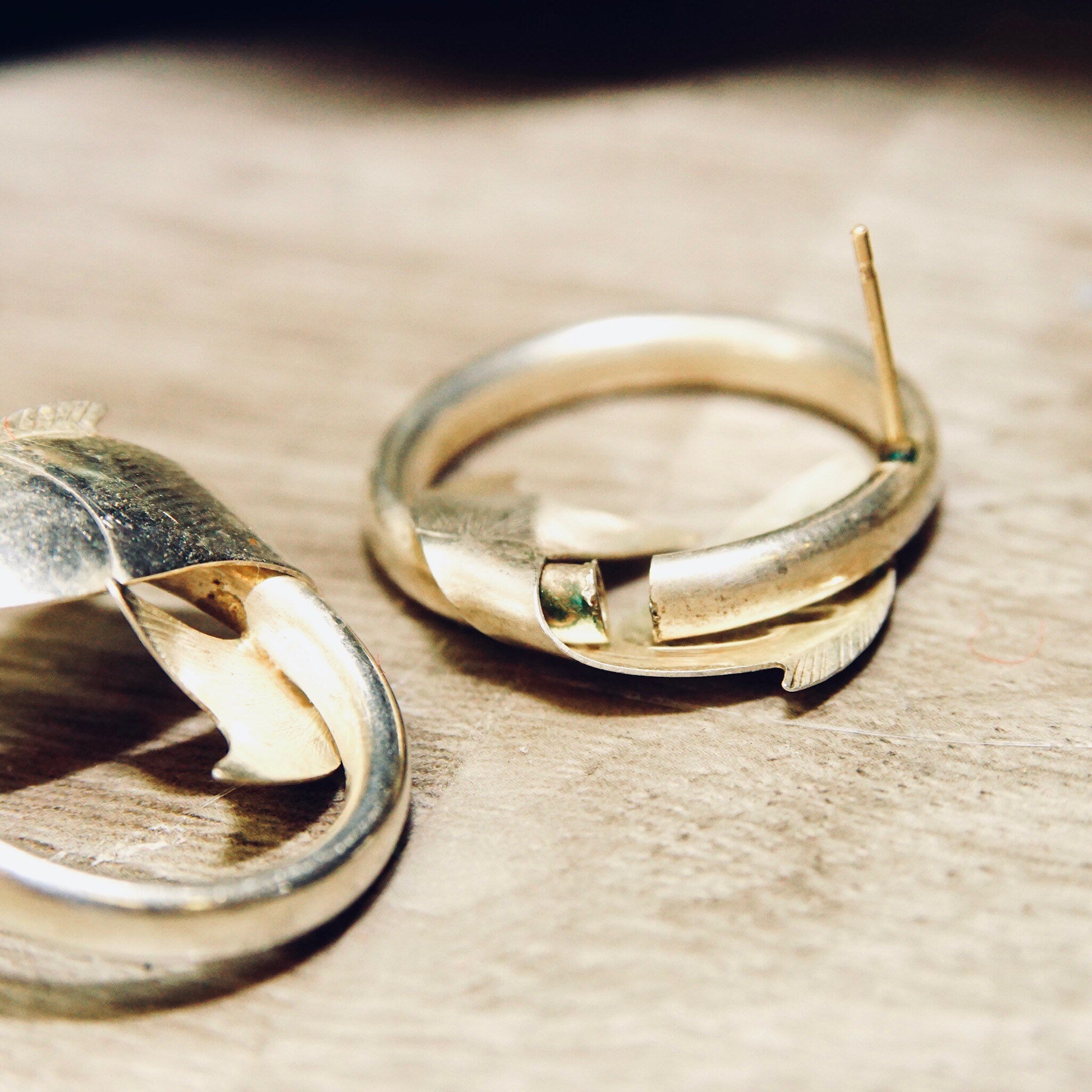 Vintage sterling silver hoop earrings with wrap-around fish design, lightweight small hoops approximately 1 inch in diameter, 925 silver.