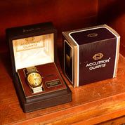 Vintage 1988 Bulova Accutron Gold Tone Swiss Quartz Day/Date Wristwatch W/ Original Box & Papers, Speidel Two-Tone Stretch Band, 7"