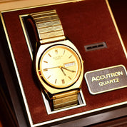 Vintage 1988 Bulova Accutron Gold Tone Swiss Quartz Day/Date Wristwatch W/ Original Box & Papers, Speidel Two-Tone Stretch Band, 7"