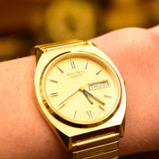 Vintage 1988 Bulova Accutron Gold Tone Swiss Quartz Day/Date Wristwatch W/ Original Box & Papers, Speidel Two-Tone Stretch Band, 7"