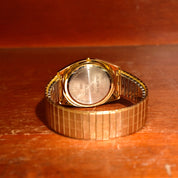 Vintage 1988 Bulova Accutron Gold Tone Swiss Quartz Day/Date Wristwatch W/ Original Box & Papers, Speidel Two-Tone Stretch Band, 7"