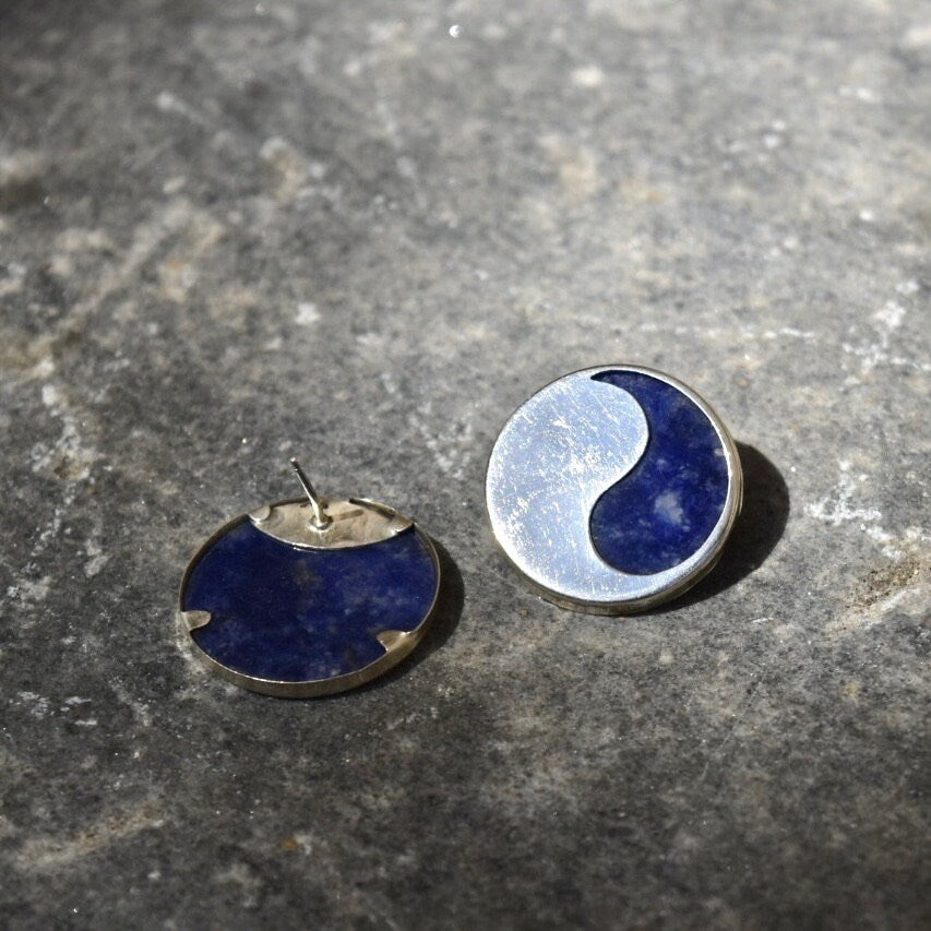 Vintage modernist sterling silver lapis lazuli yin-yang stud earrings on grey stone background