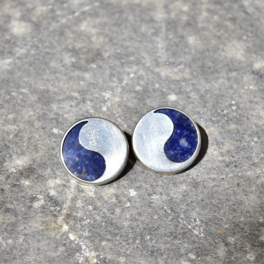 Vintage modernist sterling silver lapis lazuli yin-yang stud earrings on grey stone background