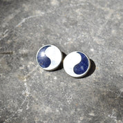 Vintage modernist sterling silver lapis lazuli yin-yang stud earrings on textured gray background