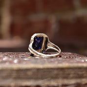 Antique Art Deco 14K white gold filigree ring with square-cut blue sapphire stone, intricate filigree inset, size 7 1/2 US, on rustic wooden surface