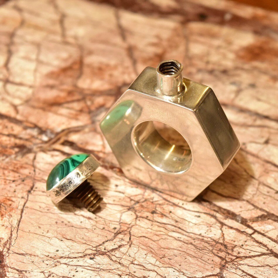 Vintage sterling silver hexagonal perfume bottle with malachite stone top, handcrafted in Taxco, Mexico. The mini bottle measures 2 inches high and features a modernist design, marked TA-187.