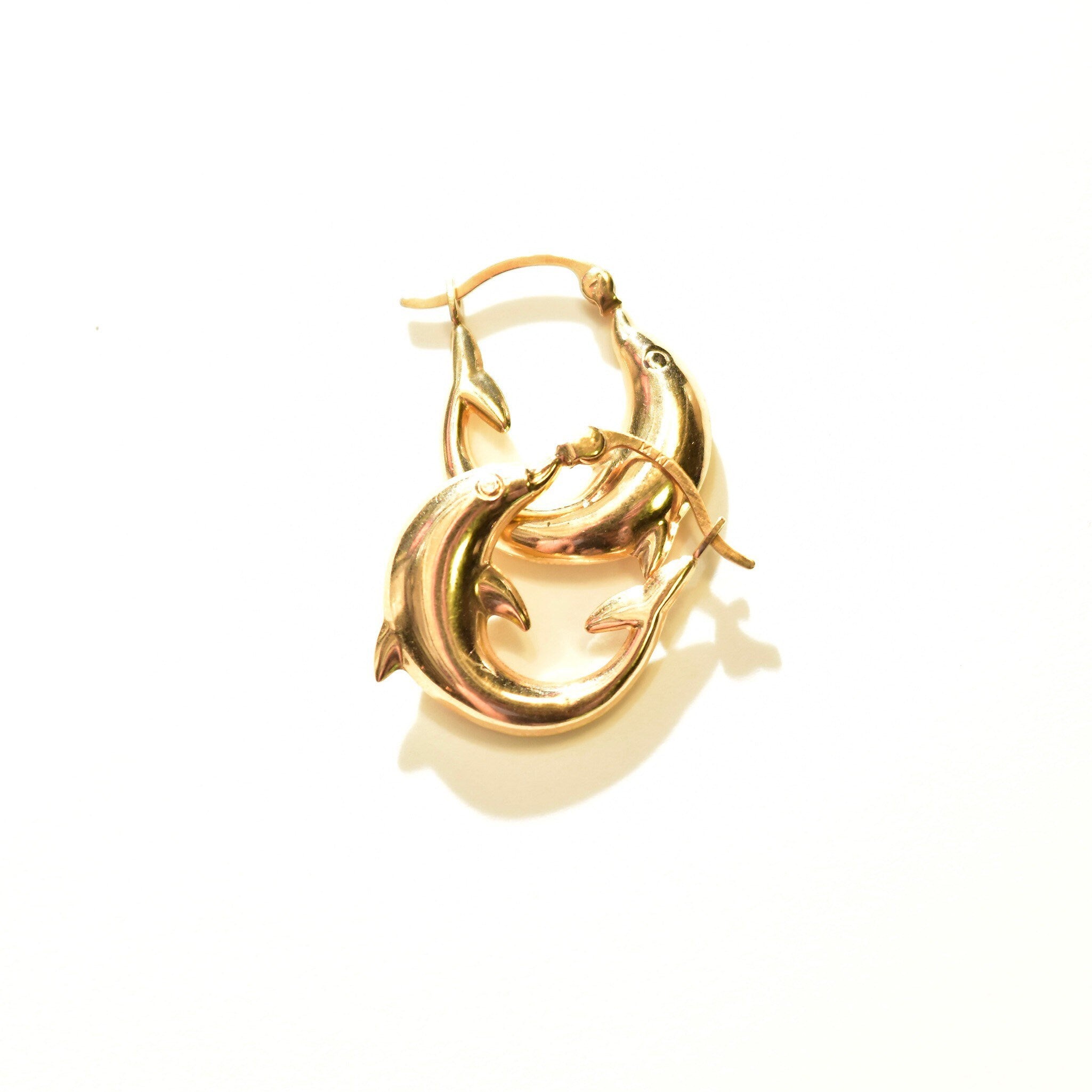 14K yellow gold dolphin hoop earrings, small oval hoops with dolphin design, 21mm size.
