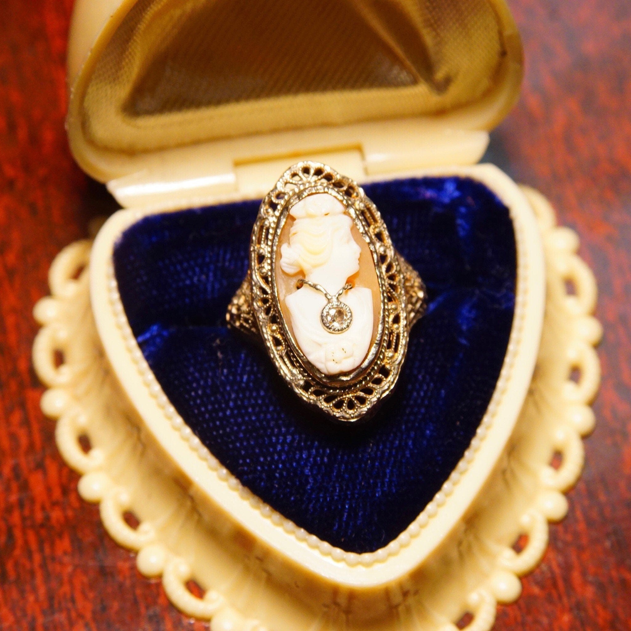 Antique 14K white gold filigree ring with carved shell cameo featuring a woman's bust wearing a diamond necklace, ring by ESEMCO in size 6 1/4 US.