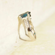 Vintage 14K white gold blue topaz cushion cut solitaire ring with diamond accents in cathedral setting, size 7.5 US