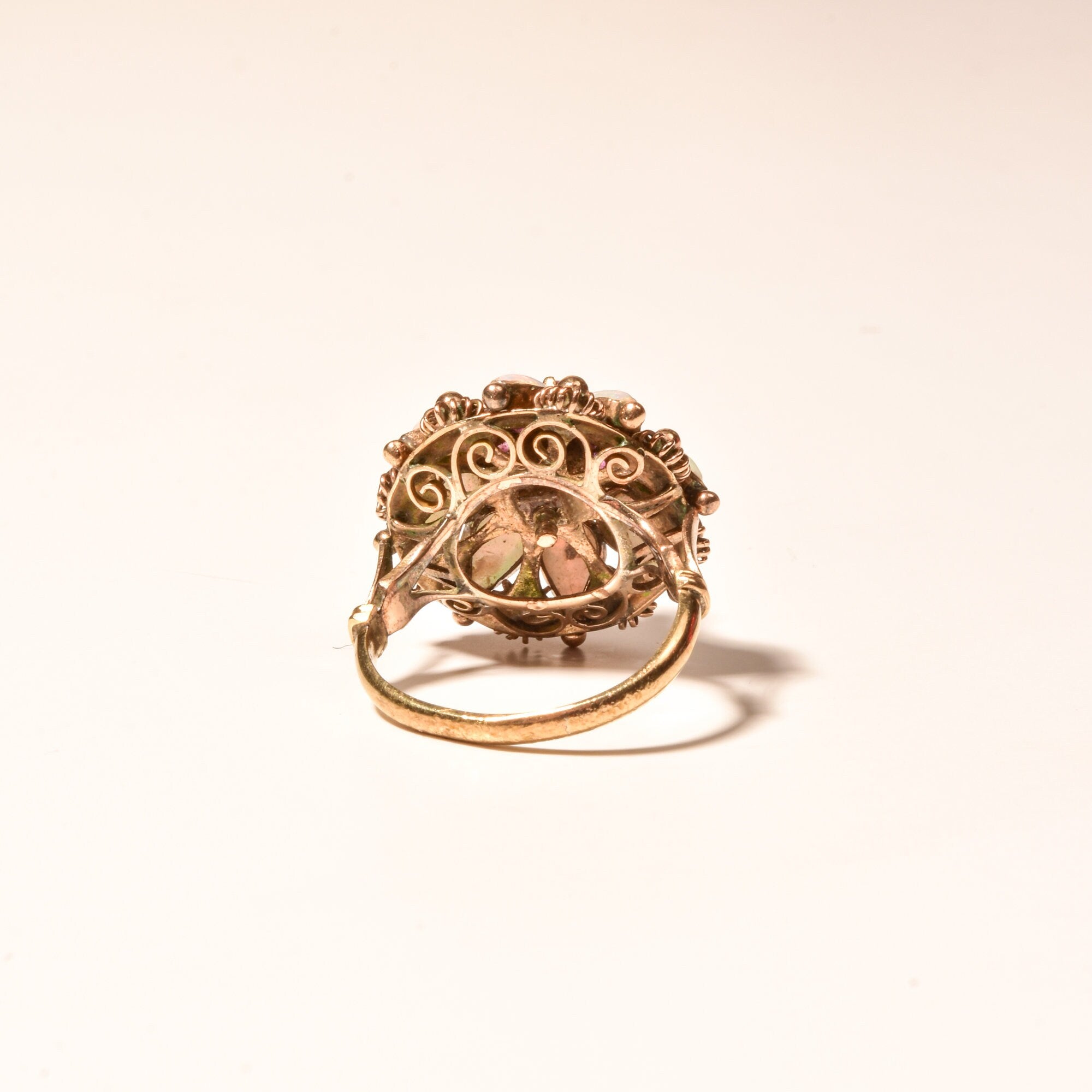 14K gold vintage Thai princess ballerina cocktail ring featuring pink ruby and white opal accents, measuring size 6 1/4 US.