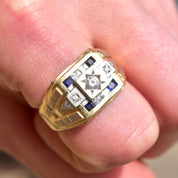 Men's 14K gold signet ring with diamond, sapphires, and engraved star design
