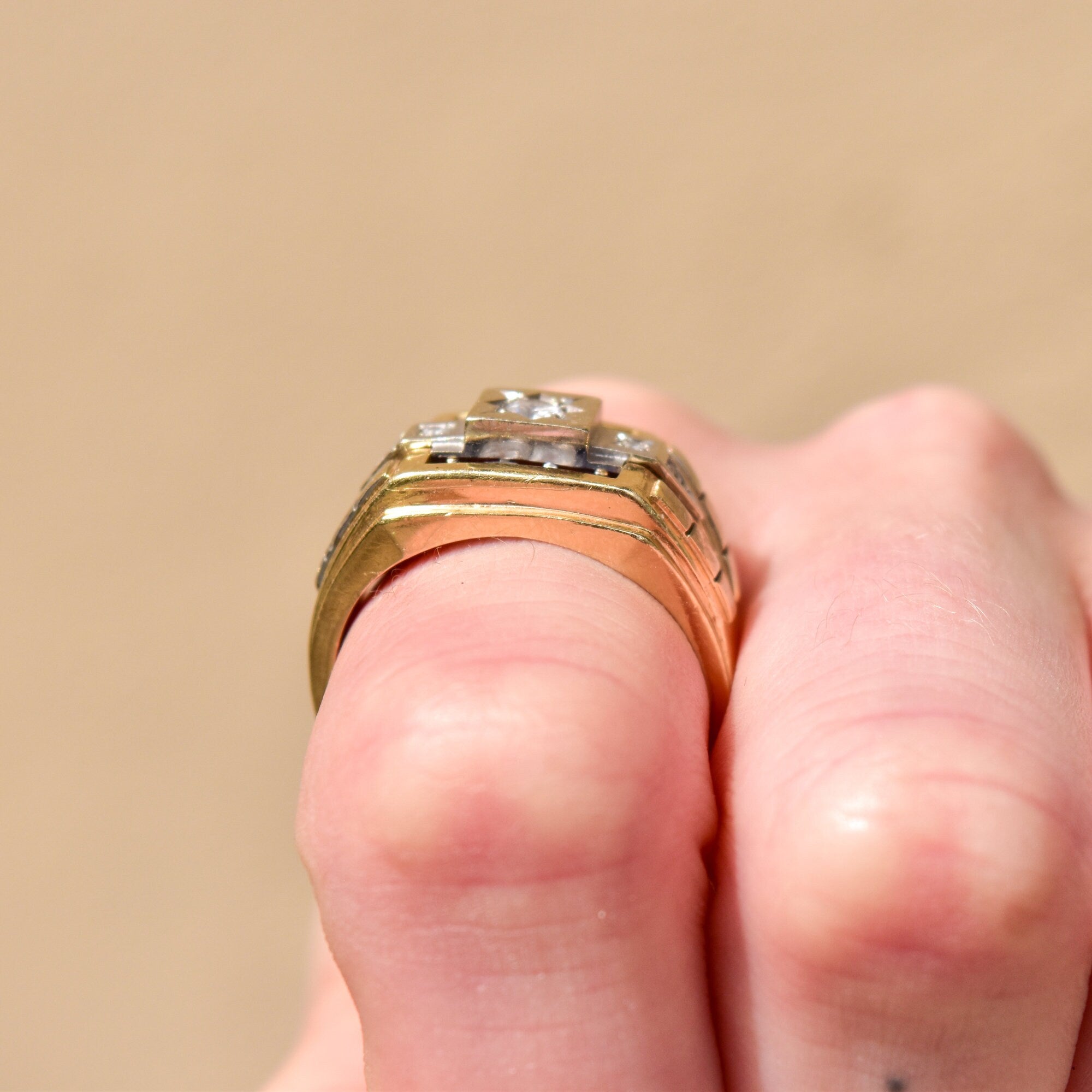 14K gold and silver men's signet ring with diamonds and sapphire in engraved star setting, shown on fingers, size 12, estate jewelry