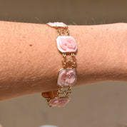 14K pink gold Italian cameo link bracelet featuring three carved shell cameos on a delicate chain, signed by M+M Scognamiglio, measuring 7 1/4 inches long, showcasing intricate estate jewelry craftsmanship.
