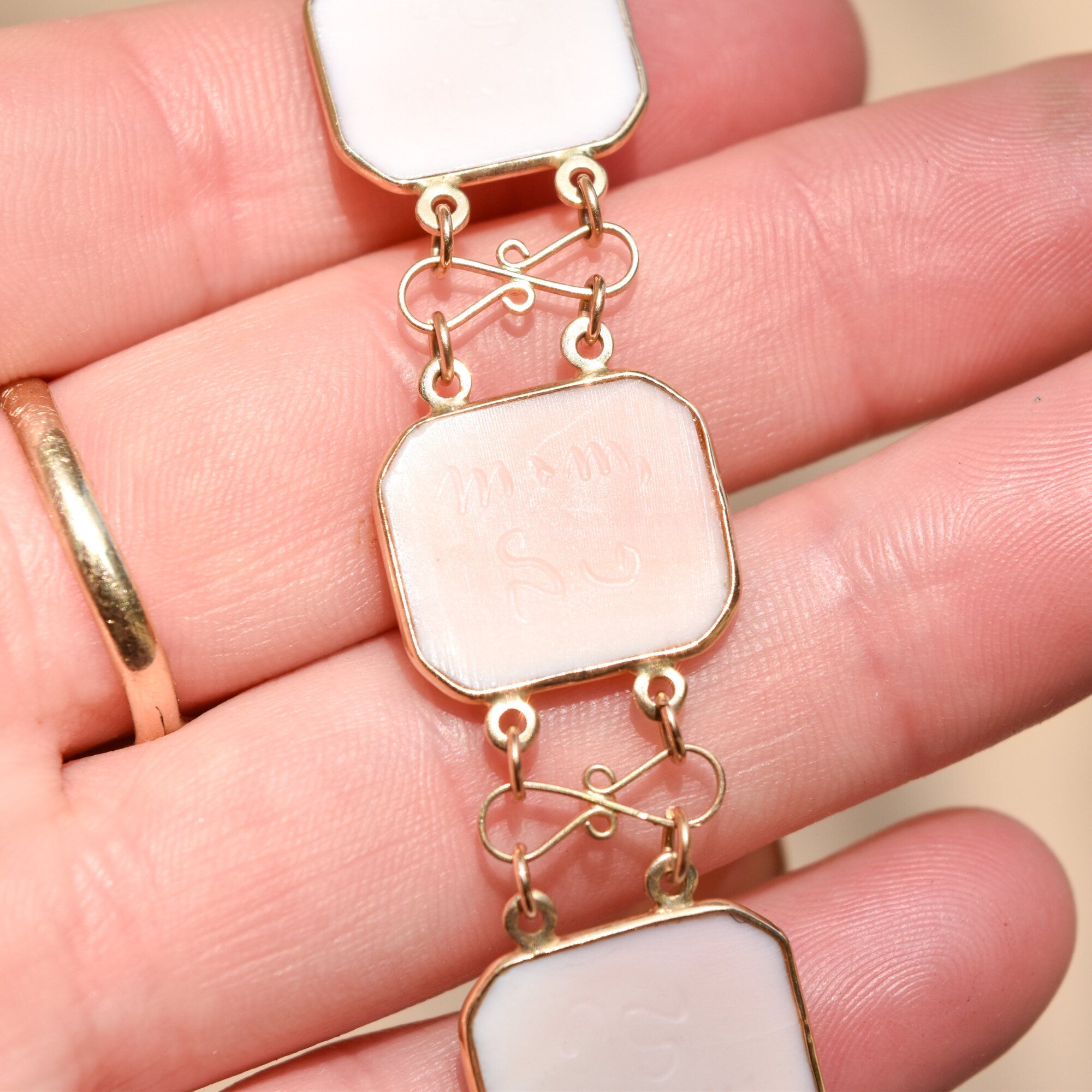 Antique 14K pink gold cameo link bracelet from Italy, signed by M+M SCOGNAMIGLIO, 7 1/4 inches long. The bracelet features square and oval shaped cameo links depicting classical female profiles, connected by delicate gold chain links. A beautiful vintage estate jewelry piece showcasing the craftsmanship of Italian goldsmiths.