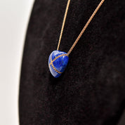 14K Gold Lapis Lazuli Heart Cross Pendant Necklace by Tiffany & Co on a Rose Gold Chain against Black Background, Minimalist Gemstone Jewelry, 18 Inch Length.