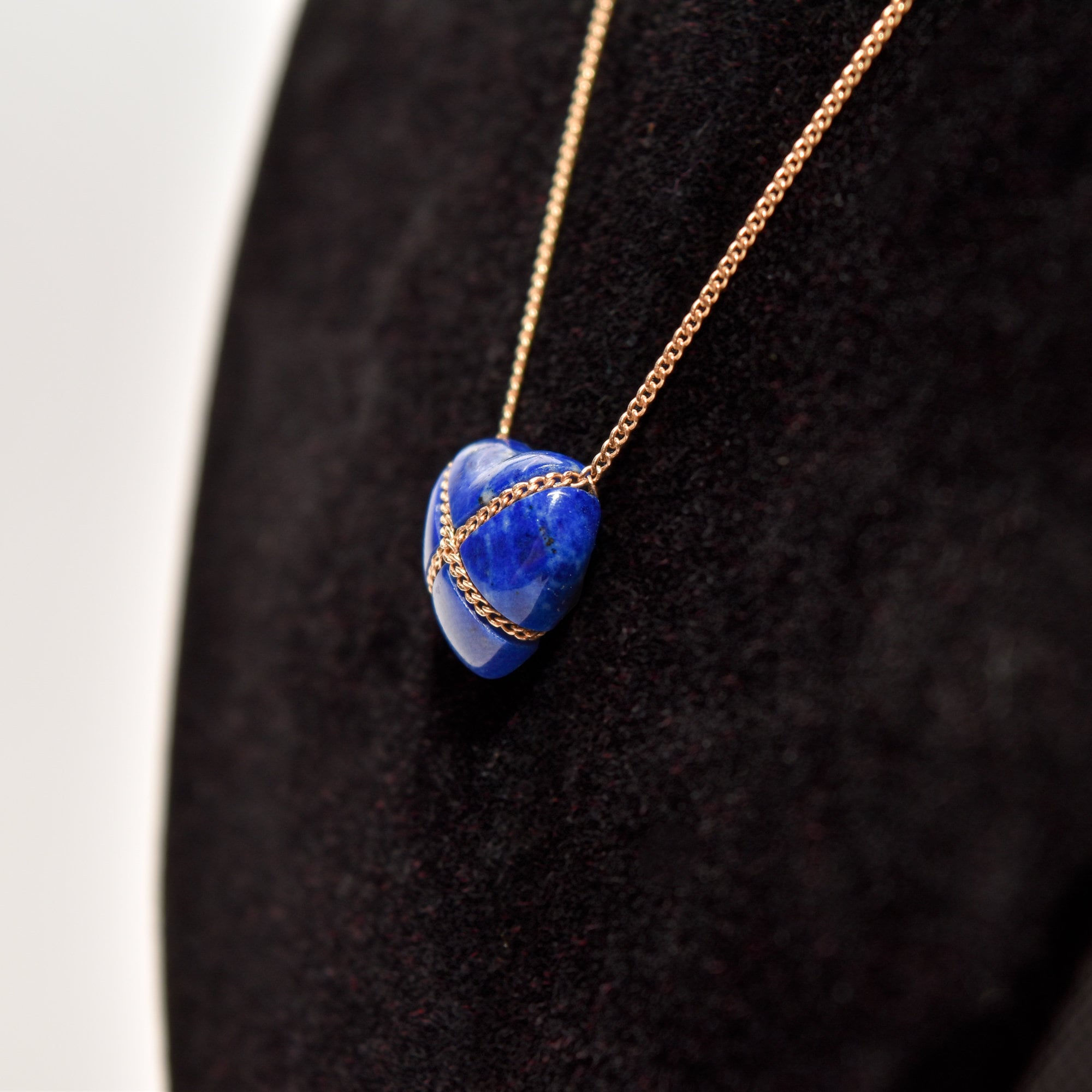 14K Gold Lapis Lazuli Heart Cross Pendant Necklace by Tiffany & Co on a Rose Gold Chain against Black Background, Minimalist Gemstone Jewelry, 18 Inch Length.